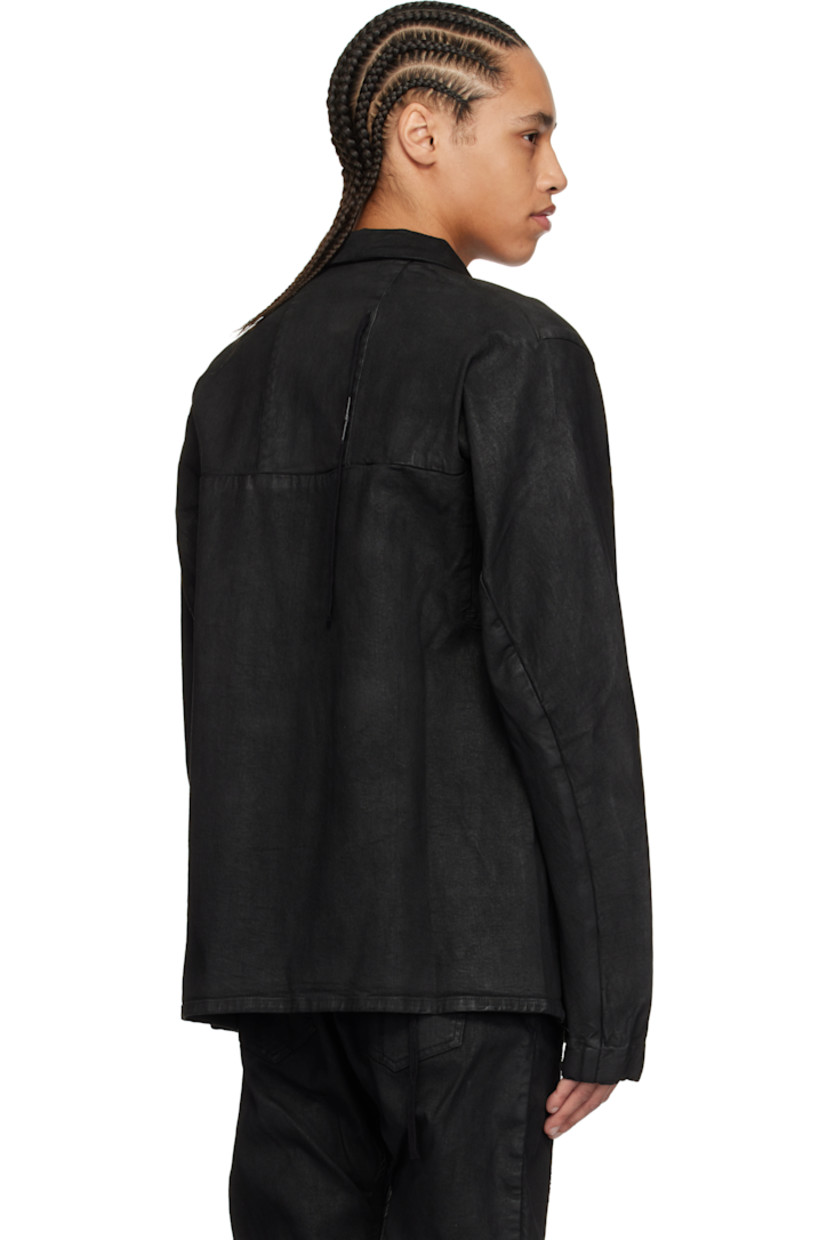 Garment-dyed and coated stretch denim jacket. 

· Spread collar 
· Concealed press-stud closure 
· Flap pockets 
· Seam pockets 
· Curved seam at sleeves 
· Thumbhole at elasticized cuffs 
· Eyelet and extended trim at back 
· Patch pocket at interior 

Supplier color: Black coated