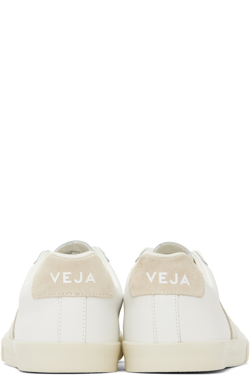 Low-top buffed leather sneakers in white.

· Lace-up closure
· Logo printed at tongue
· Padded collar
· Suede logo appliqué at sides
· Logo printed at suede heel tab
· Recycled polyester jersey lining
· Treaded rubber sole

Supplier color: White/Sable