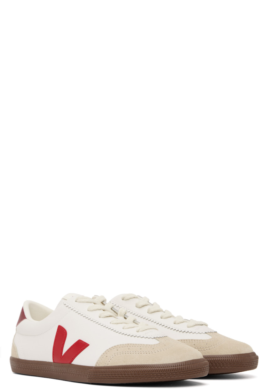 Low-top grained organic leather and suede sneakers in white. 

· Perforated detailing at toe
· Serrated trim at lace-up closure
· Logo patch at padded tongue
· Padded collar
· Logo appliqué at sides
· Logo printed at heel tab
· Recycled polyester jersey lining
· Treaded rubber sole

Supplier color: White/Pekin/Bark