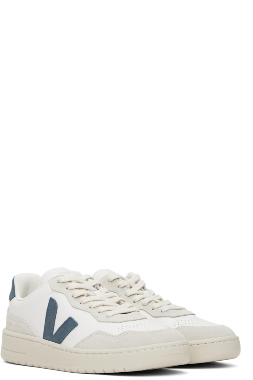 Low-top suede and grained organic leather sneakers in white and gray.

· Perforations at toe
· Lace-up closure
· Logo printed at padded tongue
· Padded collar
· Logo appliqué at sides
· Text embossed at outer side
· Logo printed at heel tab
· Recycled polyester jersey lining
· Treaded rubber sole

Supplier color: Extra-white/California