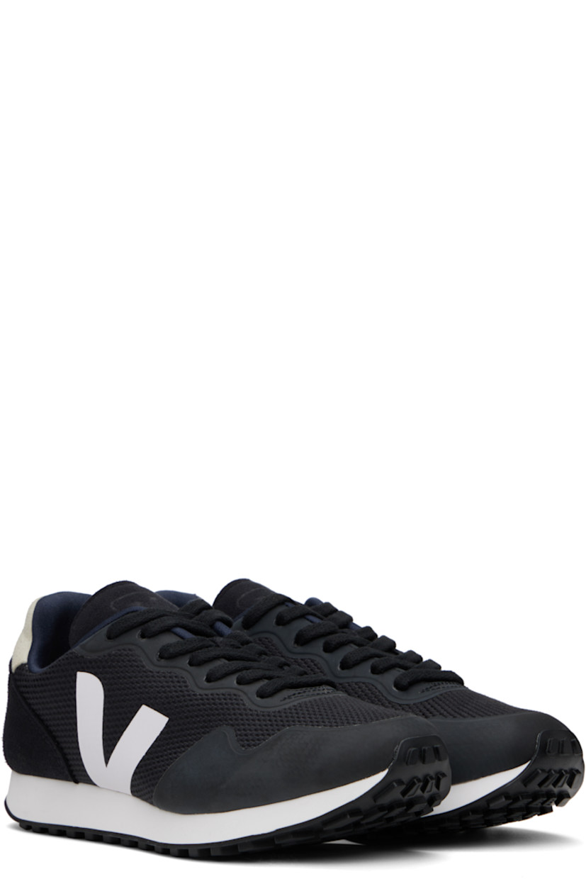 Low-top recycled B-Mesh and faux-suede sneakers in black.

· Bonded trim throughout 
· Lace-up closure
· Logo embossed at padded tongue
· Padded collar
· Logo bonded at sides
· Logo printed at heel tab
· Recycled polyester jersey lining
· Treaded rubber sole

Supplier color: Black/White