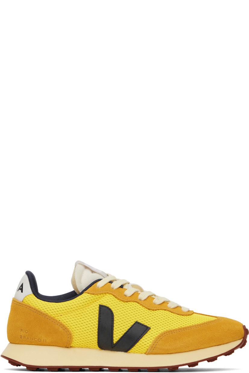 Low-top recycled Alveomesh and suede sneakers in yellow. 

· Lace-up closure
· Logo patch at padded tongue
· Padded collar
· Logo appliqué at sides
· Text embossed at outer side
· Logo printed at heel tab
· Recycled polyester jersey lining
· Treaded rubber sole

Supplier color: Tonic/Black