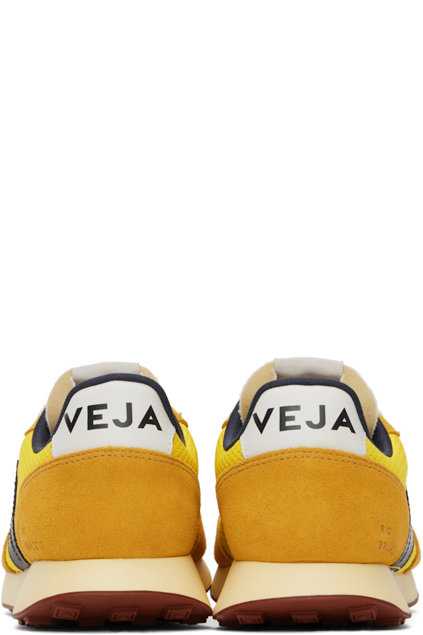 Low-top recycled Alveomesh and suede sneakers in yellow. 

· Lace-up closure
· Logo patch at padded tongue
· Padded collar
· Logo appliqué at sides
· Text embossed at outer side
· Logo printed at heel tab
· Recycled polyester jersey lining
· Treaded rubber sole

Supplier color: Tonic/Black