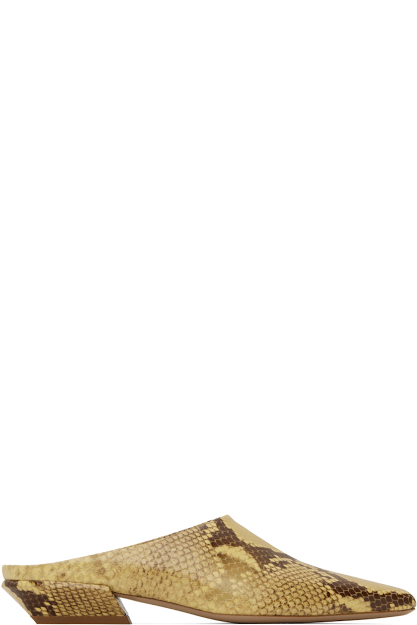 Snake-embossed calfskin slippers in beige.

· Pointed square toe 
· Logo stamp at padded footbed
· Grained leather lining 
· Block heel with rubber injection
· Leather sole 
· Heel: H1"

Supplier color: Ochre