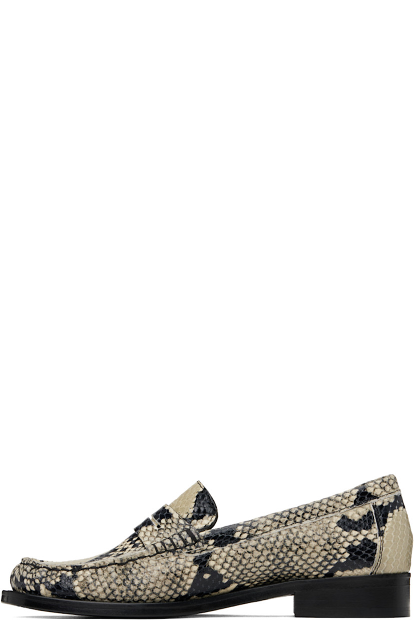 Snake-embossed calfskin loafers in beige and black.

· Moc toe
· Strap with cutout at vamp
· Buffed leather lining
· Stacked leather heel with rubber injection
· Leather sole
· Heel: H1"

Supplier color: Naturale