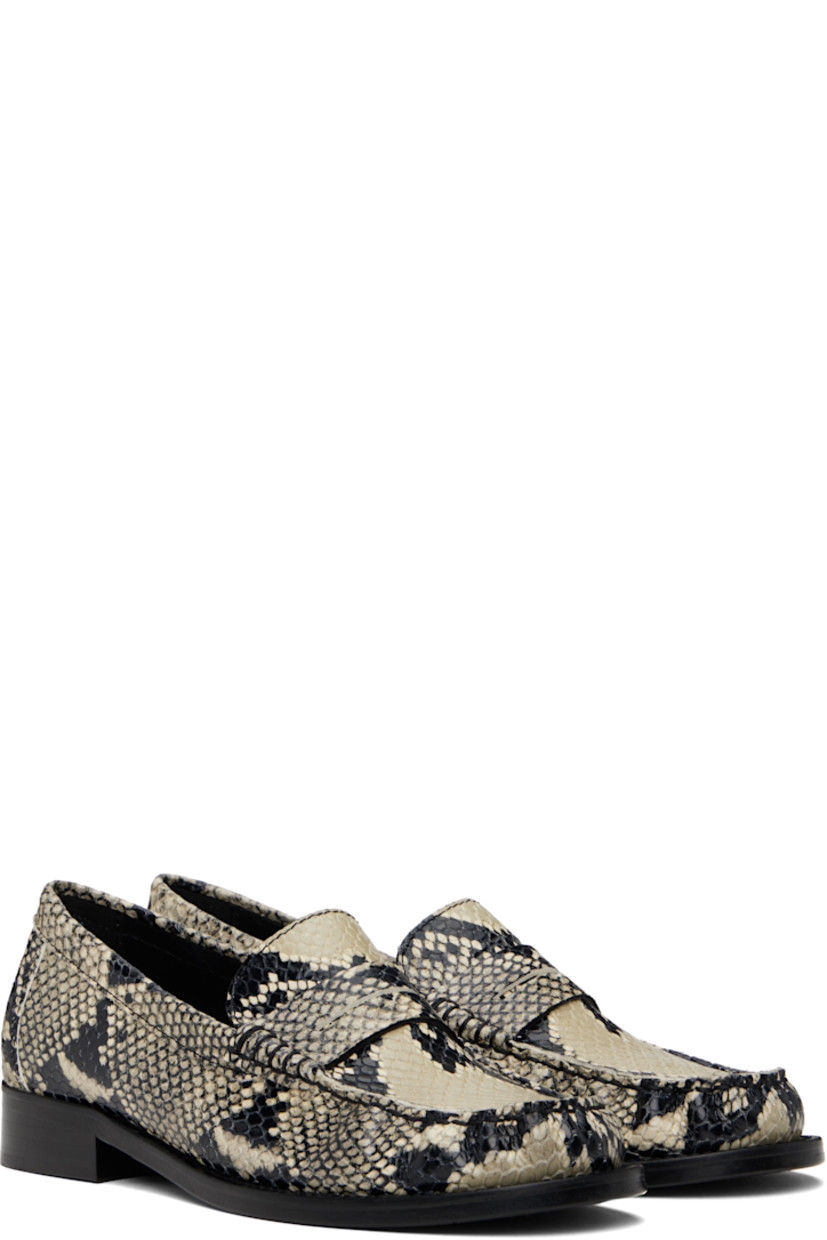 Snake-embossed calfskin loafers in beige and black.

· Moc toe
· Strap with cutout at vamp
· Buffed leather lining
· Stacked leather heel with rubber injection
· Leather sole
· Heel: H1"

Supplier color: Naturale