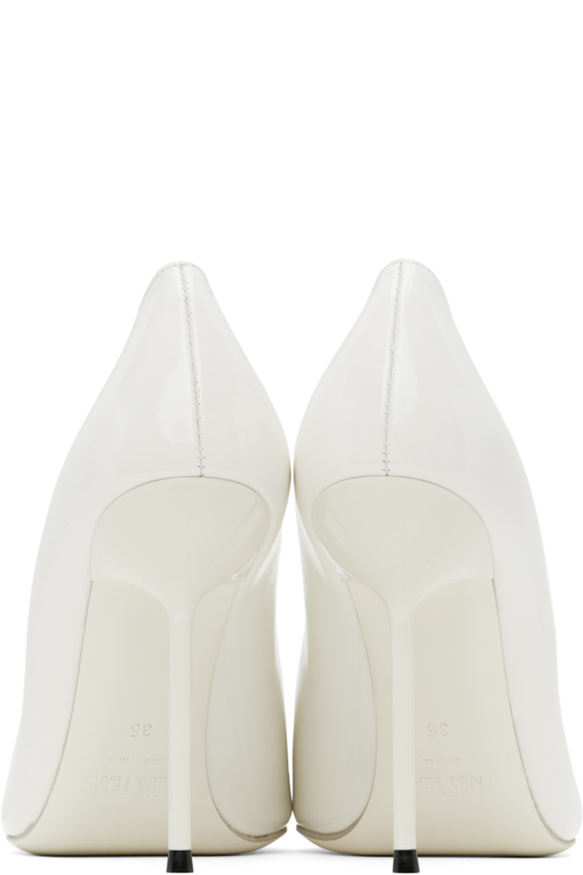Patent leather heels in white.

· Pointed toe
· Logo stamp at padded footbed
· Buffed leather lining
· Lacquered stiletto heel with rubber injection
· Leather sole
· Heel: H4"

Supplier color: White