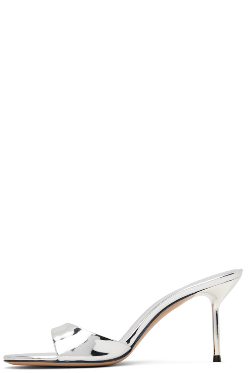 Patent leather mules in metallic silver tone.

· Open toe
· Logo stamp at padded leather footbed
· Lacquered stiletto heel with rubber injection
· Leather sole
· Heel: H3"

Supplier color: Silver