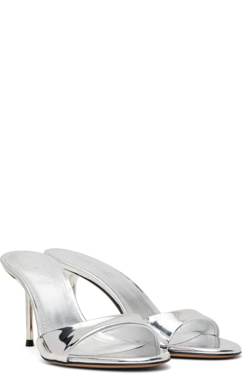 Patent leather mules in metallic silver tone.

· Open toe
· Logo stamp at padded leather footbed
· Lacquered stiletto heel with rubber injection
· Leather sole
· Heel: H3"

Supplier color: Silver