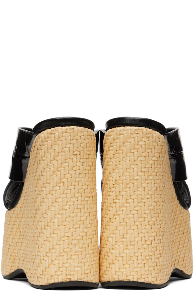Croc-embossed patent leather mules in black.

· Open square toe
· Crisscrossing straps at vamp
· Logo stamp at buffed leather footbed
· Woven raffia-covered platform midsole and wedge heel
· Smooth rubber sole
· Platform: H2"
· Heel: H5.5"

Supplier color: Black/Natural