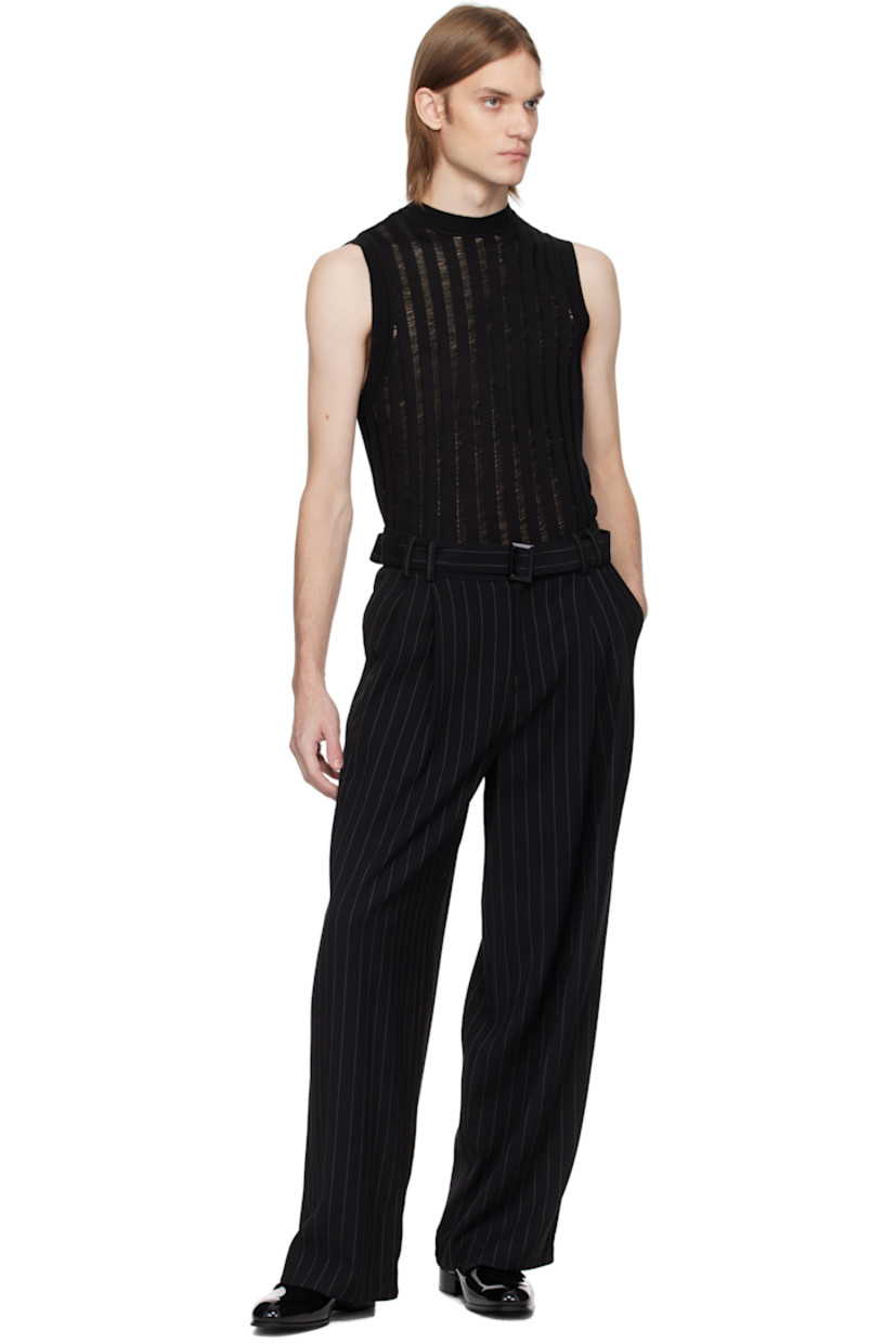 Rib-knit extrafine merino wool tank top. 

· Laddering throughout 
· Crewneck

Supplier color: Black