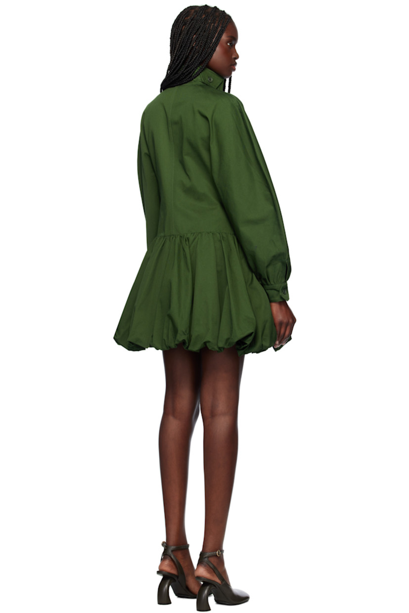 Hand-dyed cotton gabardine minidress. 

· Button tab at stand collar
· Zip closure
· Flap pocket at chest
· Gathering at dropped waist  
· Elasticized bubble hem
· Seam pockets at waist
· Single-button barrel cuffs
· Full plain-woven lining

Supplier color: Green
