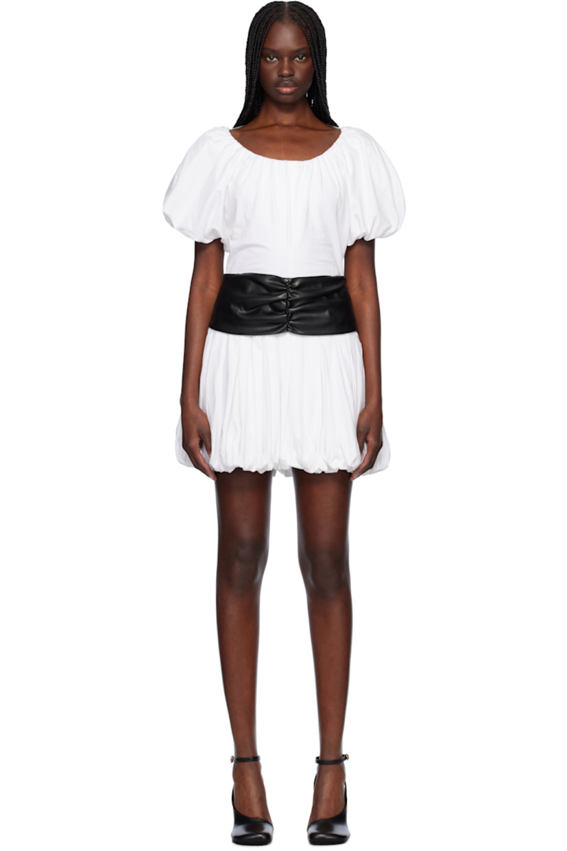 Cotton jersey minidress. Gathering and draping throughout. 

· Scoop neck
· Detachable faux-leather cinch belt 
· Pleats at dropped waist
· Bubble hem
· Padded shoulders 
· Elasticized puff sleeves
· Self-tie fastening at low back

Supplier color: White