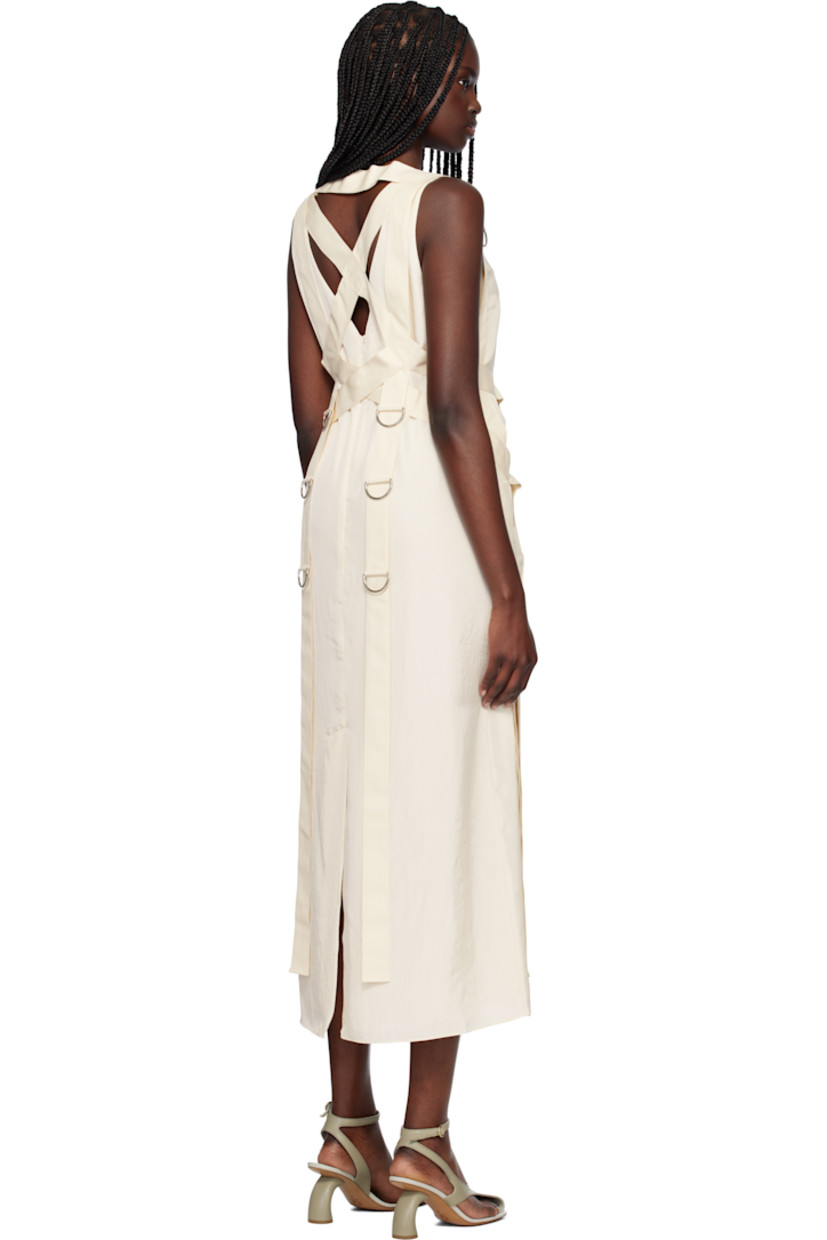 Polyester crinkled satin maxi dress. Detachable canvas harness-style overlay with D-rings. 

· Scoop neck
· Darts at chest
· Concealed zip closure at back 
· Central vent at back hem 
· Full crêpe lining

Supplier color: Cream