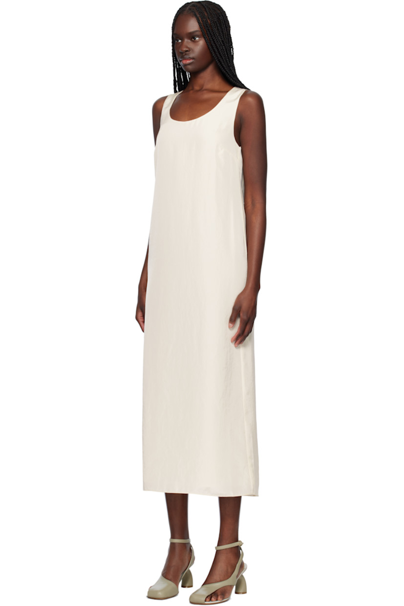 Polyester crinkled satin maxi dress. Detachable canvas harness-style overlay with D-rings. 

· Scoop neck
· Darts at chest
· Concealed zip closure at back 
· Central vent at back hem 
· Full crêpe lining

Supplier color: Cream