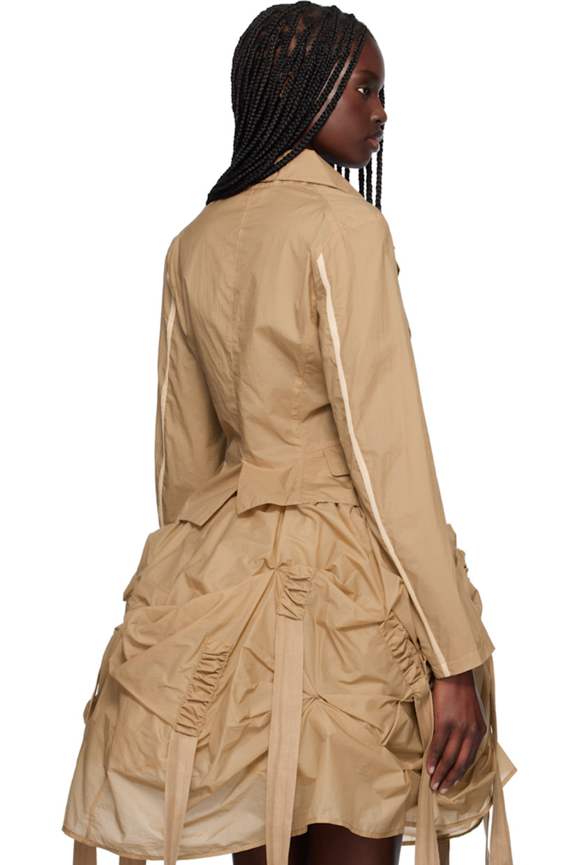 Crinkled double-faced nylon taffeta blazer. 

· Notched lapel
· Button closure
· Mock flap pockets at outseams
· Webbing trim at back sleeves
· Central vent at back hem 
· Unlined

Supplier color: Beige
