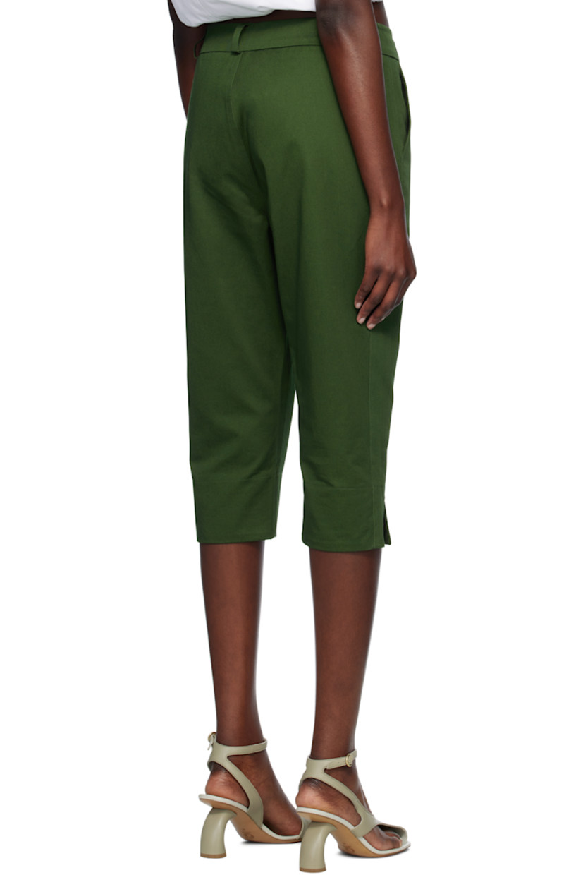 Cotton gabardine trousers. 

· Belt loops
· Two-pocket styling 
· Zip fly
· Cropped legs
· Vented cuffs
· Curved outseams

Supplier color: Green