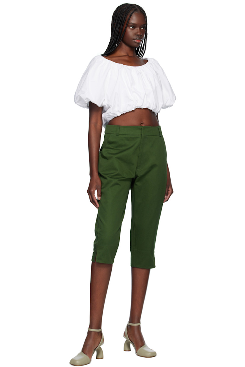 Cotton gabardine trousers. 

· Belt loops
· Two-pocket styling 
· Zip fly
· Cropped legs
· Vented cuffs
· Curved outseams

Supplier color: Green