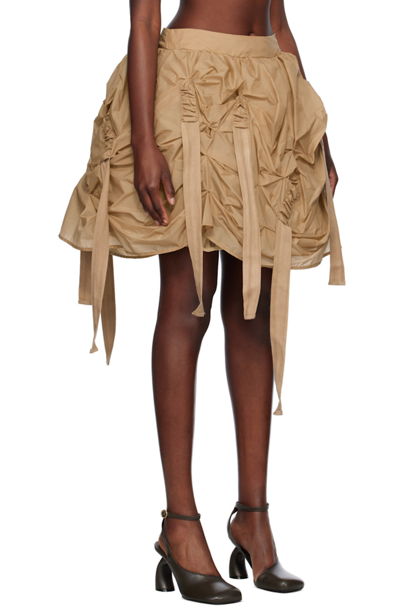 Polyester taffeta midi skirt. Ruching and extended webbing straps throughout. 

· Concealed zip closure at back hem 
· Gathered tulle lining with elasticized hem

Supplier color: Beige
