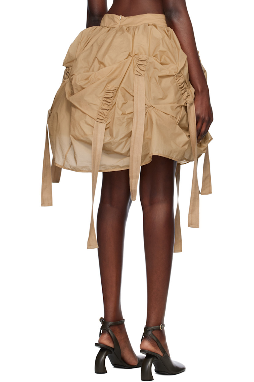Polyester taffeta midi skirt. Ruching and extended webbing straps throughout. 

· Concealed zip closure at back hem 
· Gathered tulle lining with elasticized hem

Supplier color: Beige