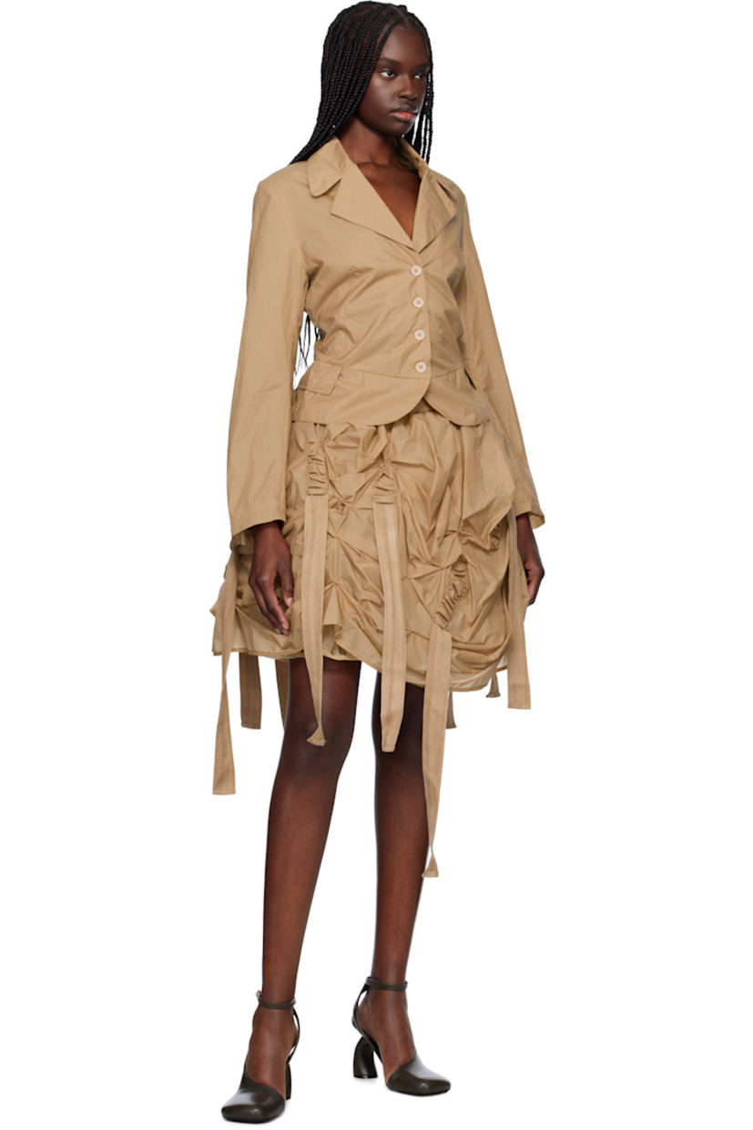 Polyester taffeta midi skirt. Ruching and extended webbing straps throughout. 

· Concealed zip closure at back hem 
· Gathered tulle lining with elasticized hem

Supplier color: Beige