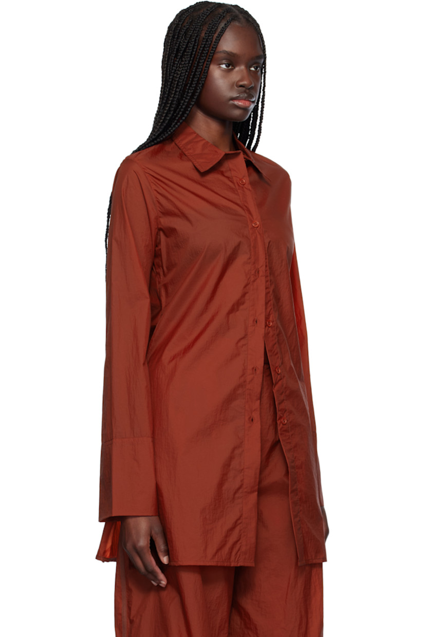 Nylon taffeta shirt. 

· Spread collar
· Button closure
· Slit at side seams 

Supplier color: Red