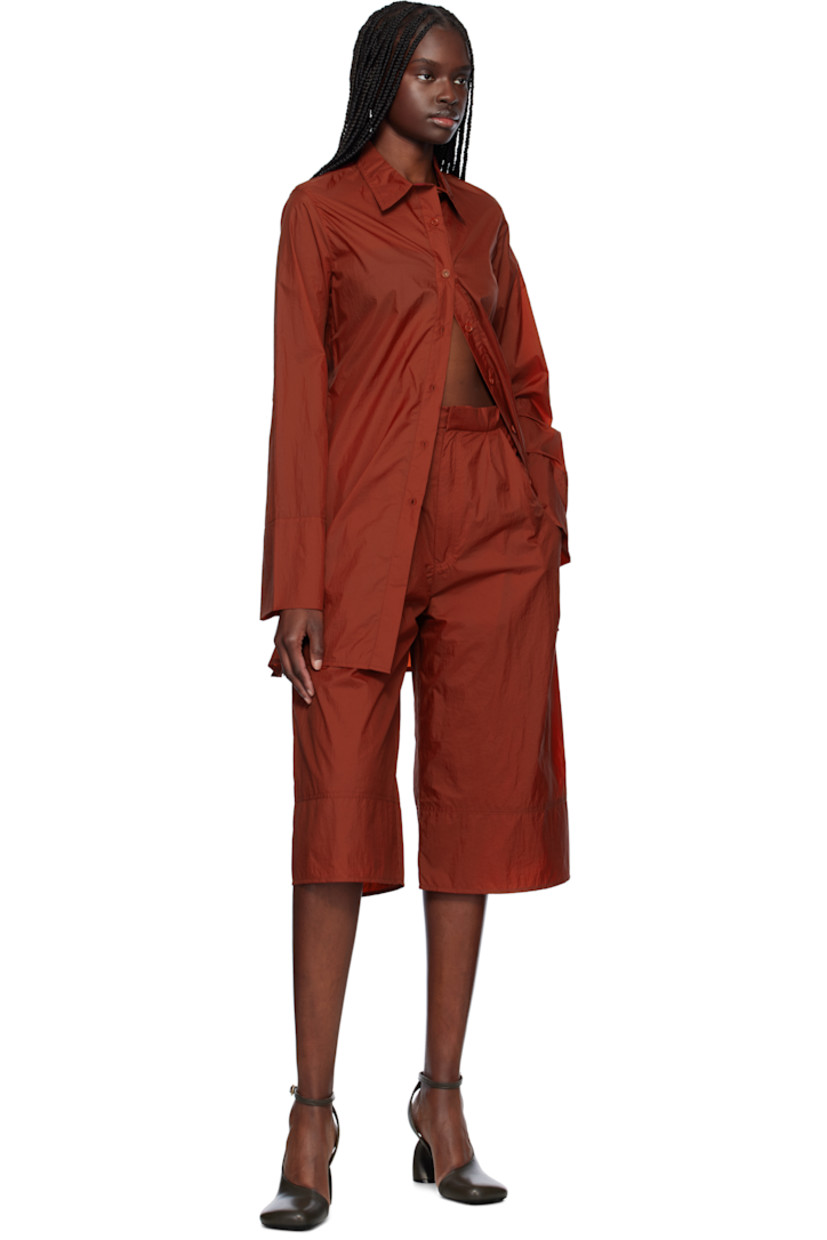 Nylon taffeta shirt. 

· Spread collar
· Button closure
· Slit at side seams 

Supplier color: Red
