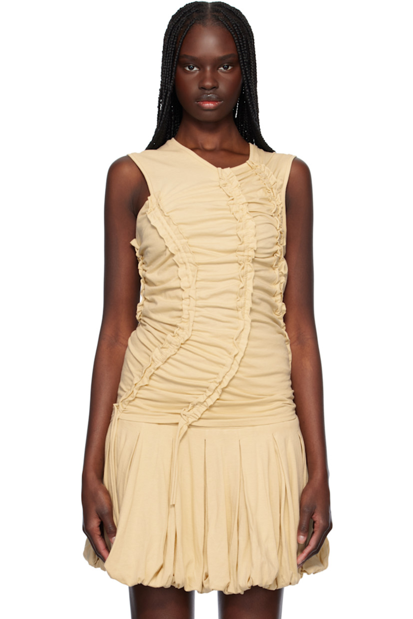Cotton jersey top. Ruching and scalloped raw edges throughout.

· Asymmetrical construction
· Rib-knit V-neck and armscyes
· Extended straps at hem
· Concealed zip closure at back

Supplier color: Beige