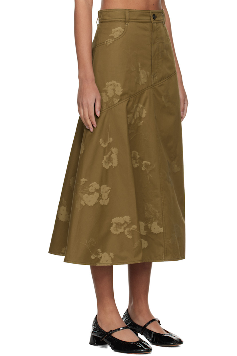 Cotton twill midi skirt. Jacquard floral pattern throughout.

· Paneled construction 
· Belt loops
· Two-pocket styling
· Zip-fly
· Asymmetric hem 
· Draping at side seam

Supplier color: Khaki