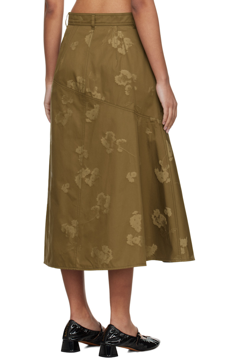 Cotton twill midi skirt. Jacquard floral pattern throughout.

· Paneled construction 
· Belt loops
· Two-pocket styling
· Zip-fly
· Asymmetric hem 
· Draping at side seam

Supplier color: Khaki