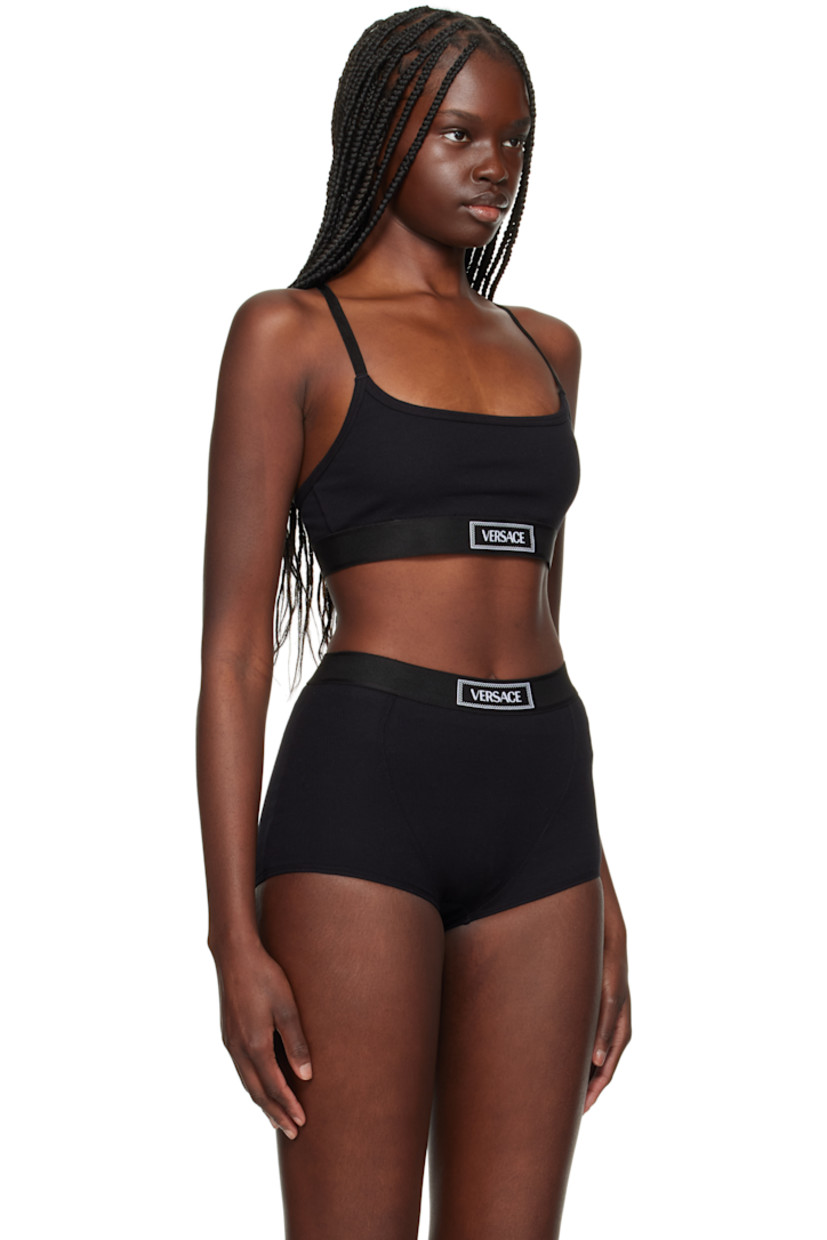 Stretch organic cotton ribbed jersey bra. 

· Scoop neck
· Jacquard logo at elasticized hem
· Logo-woven adjustable elasticized shoulder straps
· Fully lined 

Supplier color: Black