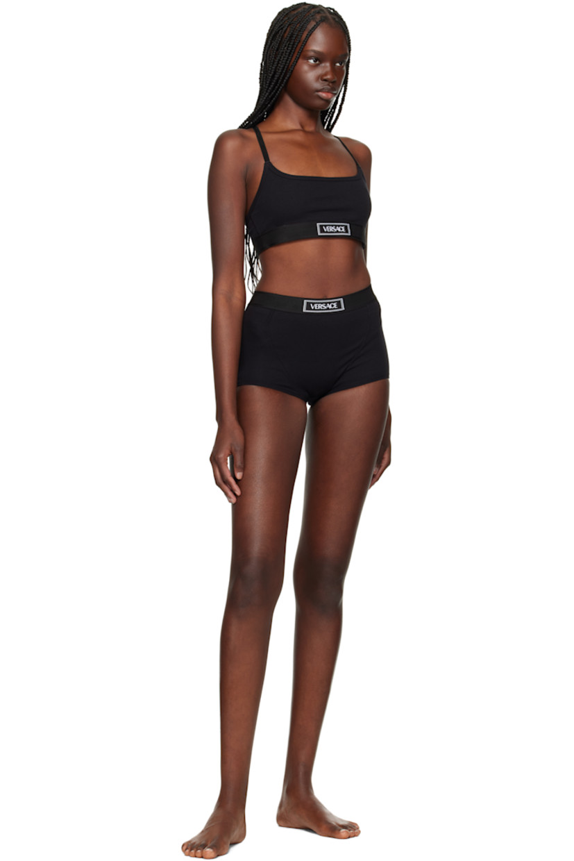 Stretch organic cotton ribbed jersey bra. 

· Scoop neck
· Jacquard logo at elasticized hem
· Logo-woven adjustable elasticized shoulder straps
· Fully lined 

Supplier color: Black