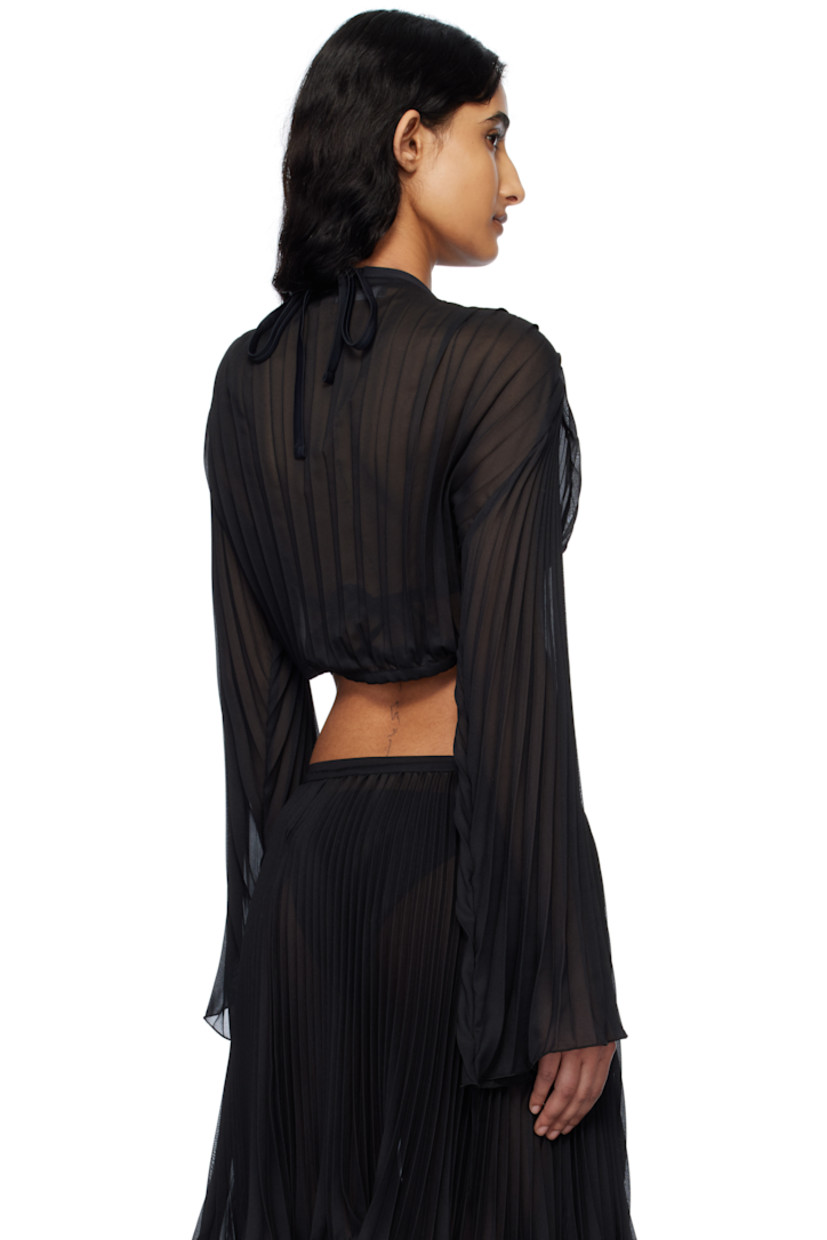Semi-sheer garment-pleated polyester chiffon cover-up top.

· Plunging V-neck
· Medusa safety pin and self-tie fastening at front
· Cropped hem
· Flared sleeves

Supplier color: Black