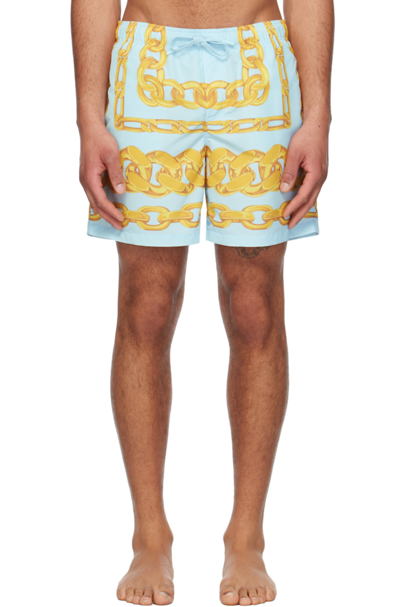 Polyester taffeta swim shorts. Graphic pattern printed throughout.

· Drawstring at elasticized waistband
· Three-pocket styling
· Mock fly
· Integrated brief-style mesh lining

Supplier color: Blue/Gold