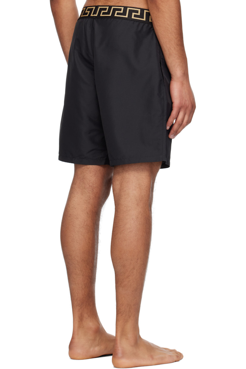 Tapered straight-leg polyester faille swim shorts. 

· Jacquard Greca pattern at elasticized waistband
· Two-pocket styling 
· Mock fly
· Integrated brief-style jersey lining

Supplier color: Black