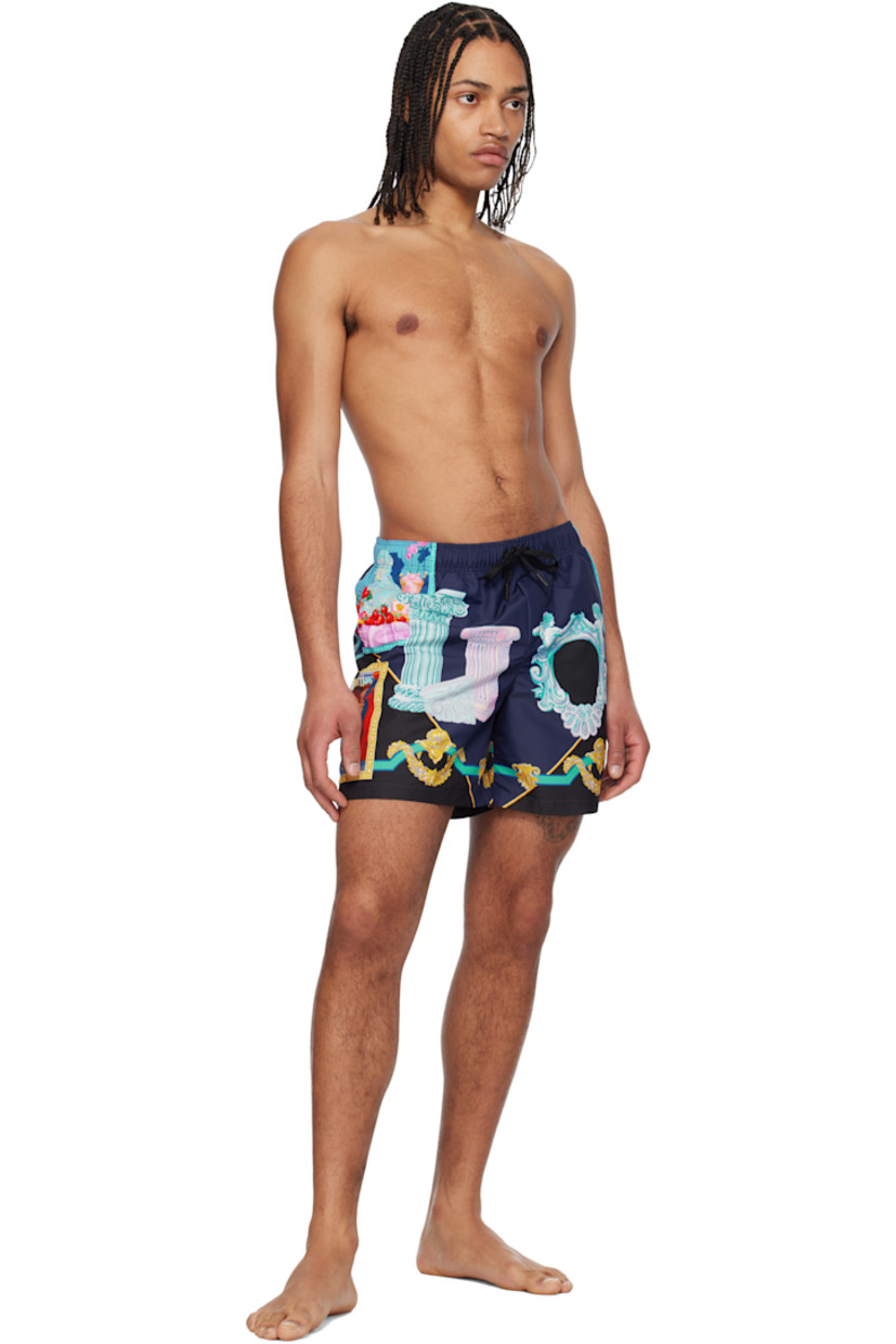Polyester taffeta swim shorts. Logo graphic pattern printed throughout.

· Drawstring at elasticized waistband
· Three-pocket styling
· Mock fly
· Integrated brief-style mesh lining

Supplier color: Blue/Print