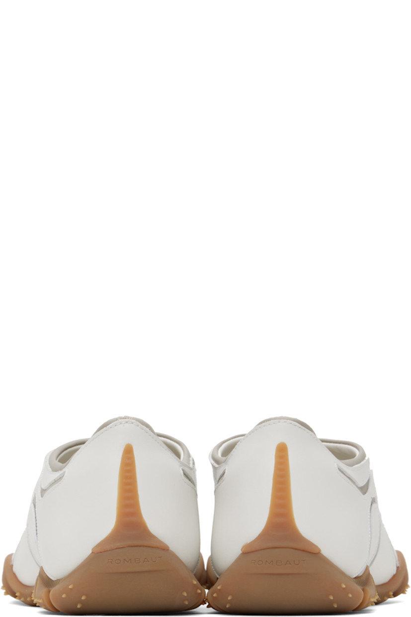 Low-top buffed faux-leather slip-on sneakers in white and gray.

· Faux-leather appliqués throughout
· Padded faux-leather logo patch at vamp 
· Padded collar
· Logo embossed at heel
· Spikes at rubber midsole
· Treaded rubber sole

Supplier color: Grey/White