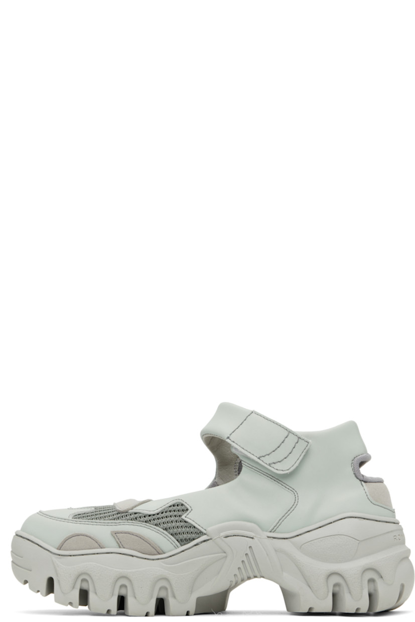 Handcrafted low-top buffed faux-leather Mary Jane-style sneakers in blue.

· Cutouts throughout
· Velcro strap at vamp
· Mesh and faux-nubuck lining
· Treaded rubber platform sole
· Platform: H2"

Supplier color: Medic