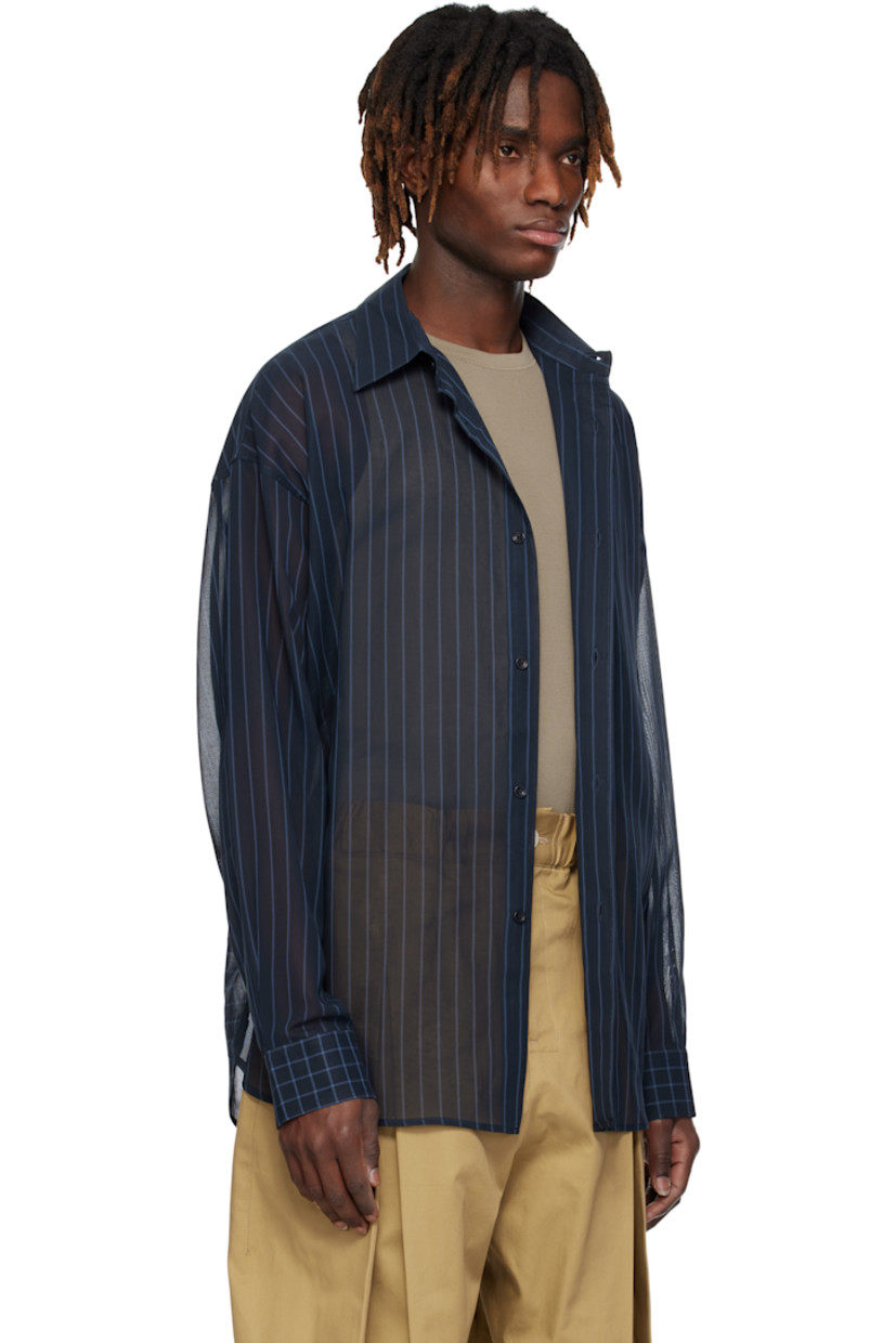 Sheer nylon chiffon shirt. Stripe and check pattern throughout.

· Paneled construction 
· Spread collar
· Button closure
· Shirttail hem
· Dropped shoulders
· Pleated buttoned barrel cuffs
· Box pleat at yoke

Supplier color: Navy/Cornflower blue