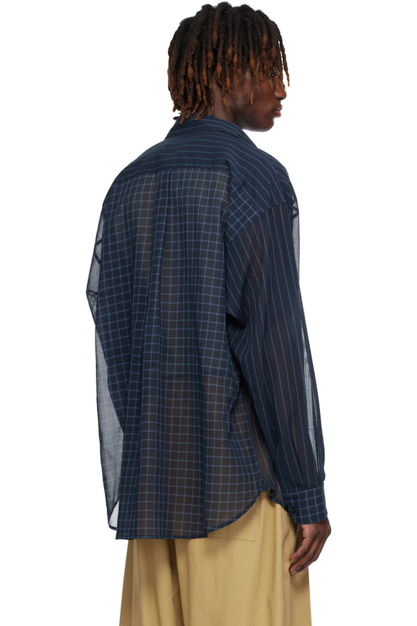 Sheer nylon chiffon shirt. Stripe and check pattern throughout.

· Paneled construction 
· Spread collar
· Button closure
· Shirttail hem
· Dropped shoulders
· Pleated buttoned barrel cuffs
· Box pleat at yoke

Supplier color: Navy/Cornflower blue