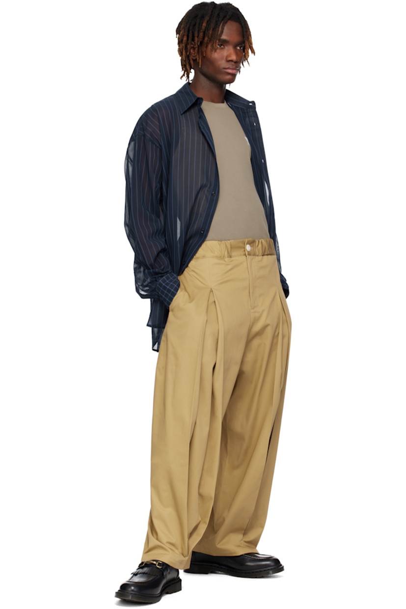 Sheer nylon chiffon shirt. Stripe and check pattern throughout.

· Paneled construction 
· Spread collar
· Button closure
· Shirttail hem
· Dropped shoulders
· Pleated buttoned barrel cuffs
· Box pleat at yoke

Supplier color: Navy/Cornflower blue