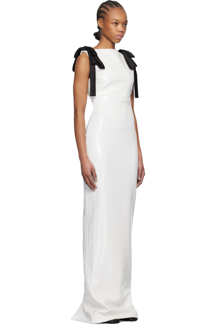 Sequinned plain-woven polyester maxi dress.

· Straight neck 
· Satin bow at shoulders
· Concealed zip closure at back collar
· Central vent at back hem
· Full jersey lining 

Supplier color: White/Black bow