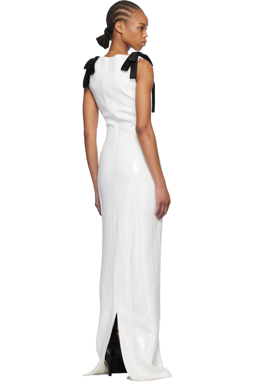 Sequinned plain-woven polyester maxi dress.

· Straight neck 
· Satin bow at shoulders
· Concealed zip closure at back collar
· Central vent at back hem
· Full jersey lining 

Supplier color: White/Black bow