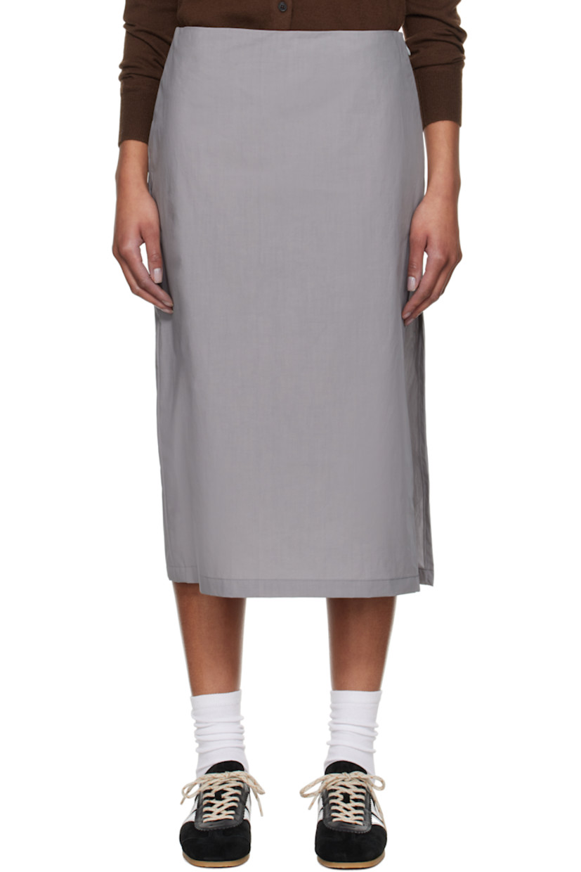 Coated plain-woven cotton midi skirt.

· Concealed zip closure at side
· Vented side seam
· Darts at back waistband
· Unlined

Supplier color: Inox waxed