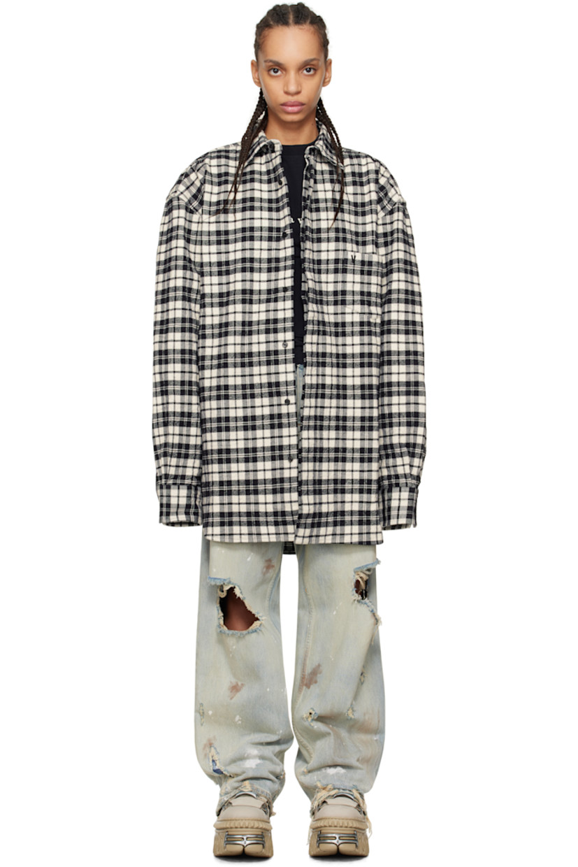 Crinkled cotton flannel shirt. Check pattern throughout.

�· Spread collar
· Concealed button closure
· Adjustable buttoned barrel cuffs
· Dropped shoulders

Supplier color: Black check