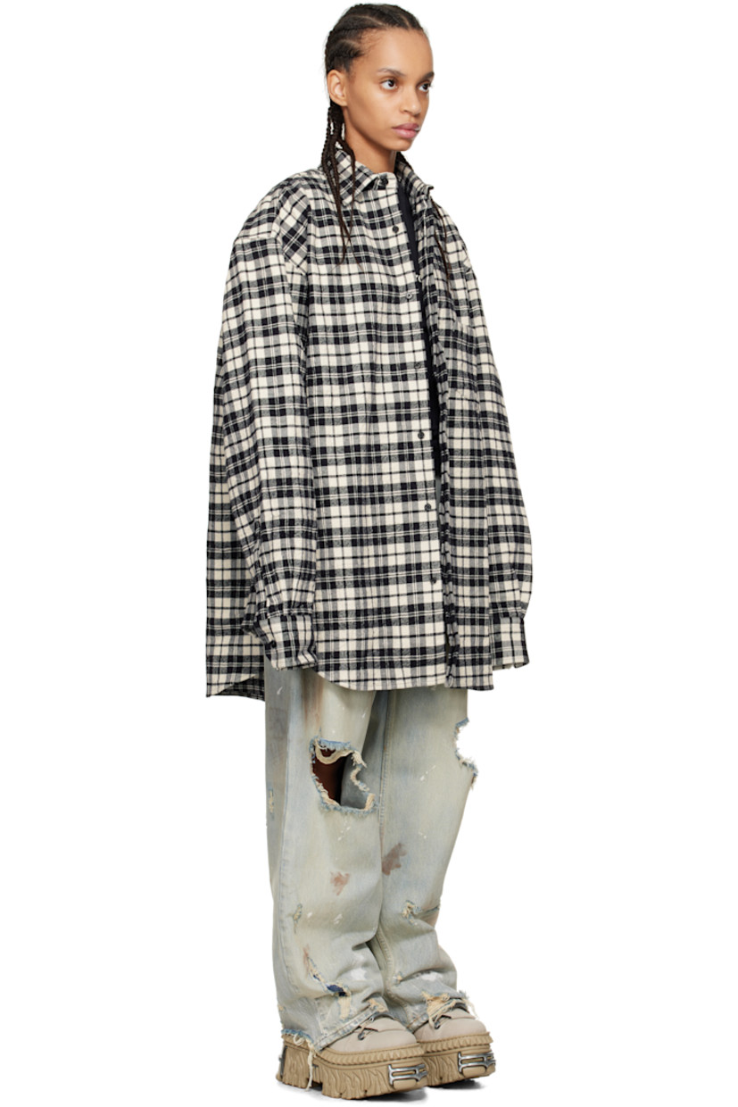 Crinkled cotton flannel shirt. Check pattern throughout.

· Spread collar
· Concealed button closure
· Adjustable buttoned barrel cuffs
· Dropped shoulders

Supplier color: Black check