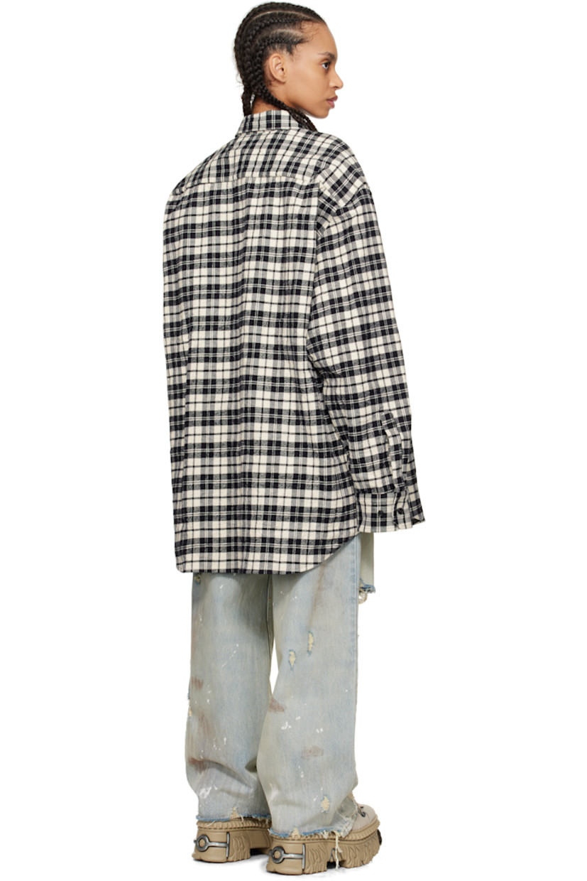 Crinkled cotton flannel shirt. Check pattern throughout.

· Spread collar
· Concealed button closure
· Adjustable buttoned barrel cuffs
· Dropped shoulders

Supplier color: Black check