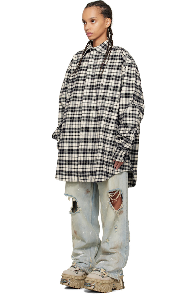 Crinkled cotton flannel shirt. Check pattern throughout.

· Spread collar
· Concealed button closure
· Adjustable buttoned barrel cuffs
· Dropped shoulders

Supplier color: Black check