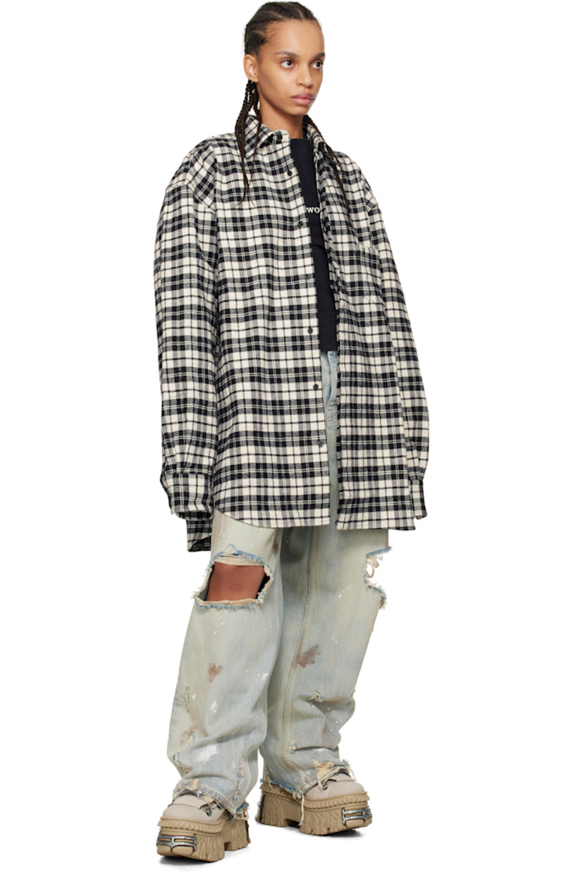 Crinkled cotton flannel shirt. Check pattern throughout.

· Spread collar
· Concealed button closure
· Adjustable buttoned barrel cuffs
· Dropped shoulders

Supplier color: Black check