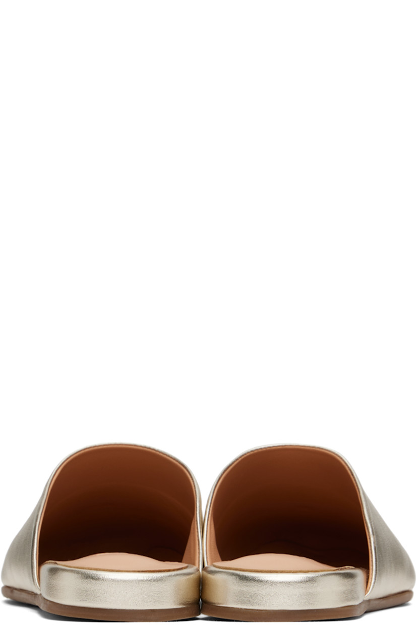 Handcrafted buffed nappa leather mules in metallic gold tone.

· Logo-embossed padded leather footbed
· Grained calfskin lining
· Logo-treaded rubber sole

Supplier color: Platinum